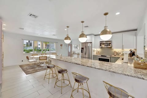 The airy, open kitchen offers ample space & all the comforts of home