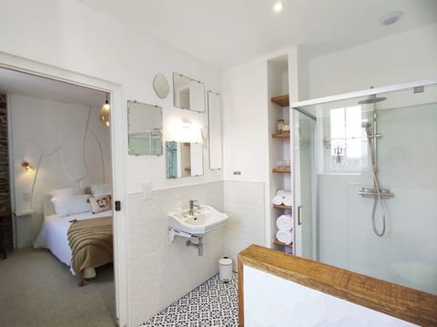 Shower, rainfall showerhead, hair dryer, towels