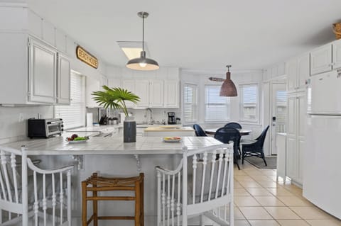 Coastal charm meets modern convenience in this beachy kitchen! 