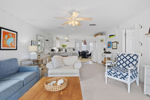 A living room made for relaxation! Cozy sofas, coastal charm, and fresh air