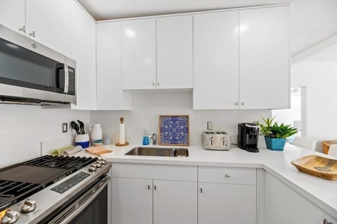 Kitchen is located right as you enter the home.  It has all kitchen essentials needed for a comfortable stay. 
Keurig Coffee make and coffee provided. 