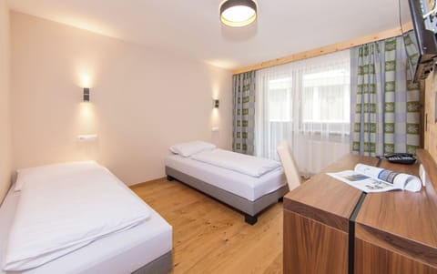 Deluxe Room, Balcony | Living area | TV