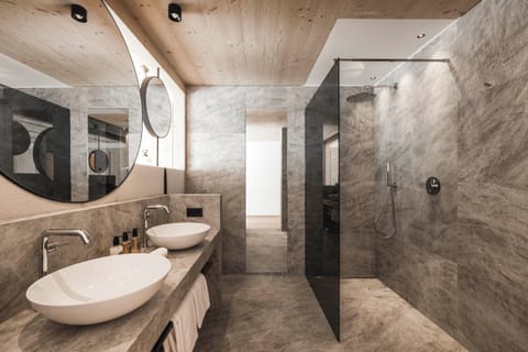 Designer toiletries, hair dryer, bathrobes, slippers