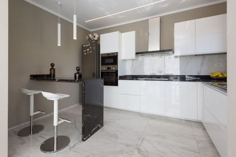 Furniture, Kitchen, Interior Design, Flooring, Countertop, Wood, Floor, Cabinetry, Ceiling, Kitchen Appliance