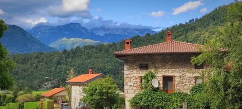 Front of house with Julian Alps behind