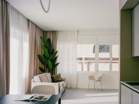 Superior Studio Suite, City View | Free minibar, desk, laptop workspace, free WiFi