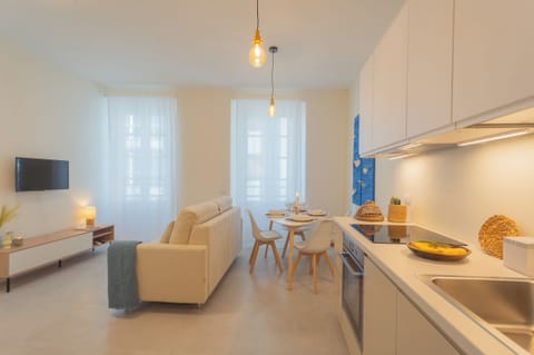 Apartment (1 Bedroom) | Living area | 32-inch flat-screen TV with cable channels