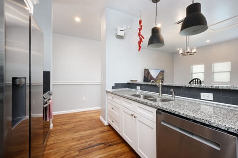 Clean and contemporary kitchen featuring sleek granite countertops