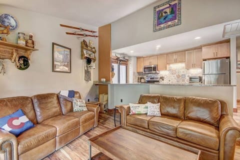 Beautiful living room with antique hutch, electric fireplace, Smart TV with cable, two amazing leather sofas- one with a queen bed, the other has two recliners for relaxing after a day in the mountains. Opens to a balcony with gas grill.