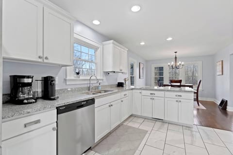 Bright, spacious, and well equipped-- this kitchen is the perfect place to cook relax, and enjoy your stay!