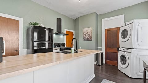 Fully equipped kitchen with in home laundry.