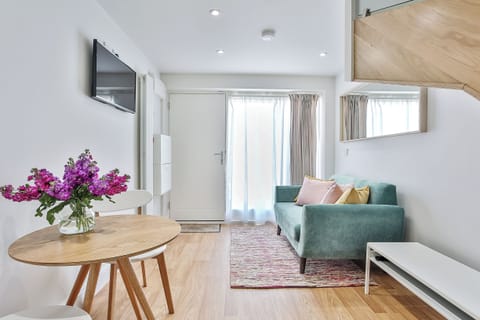 Apartment | Living area | 40-inch LED TV with satellite channels