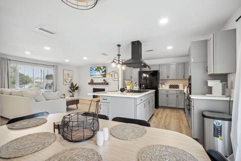 Dining Area overlooking Living Room Area and Kitchen Island