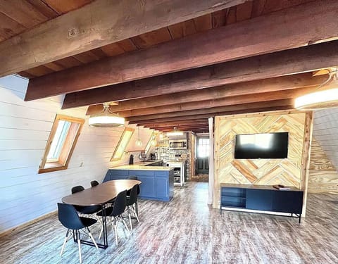 main living area with dining for 6 and another 2 seats around the corner