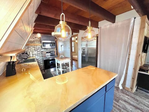 updated kitchen with new, stackable washer/dryer behind the curtain (2)