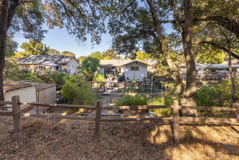 view of the back of the home from the trail
