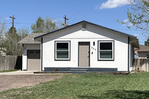 View from street showing garage and main entry.