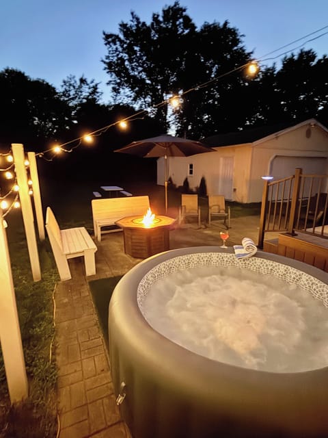 PATIO with Night Lighting, HOT TUB, Gas FIRE TABLE,  Bench Seating, & Chairs