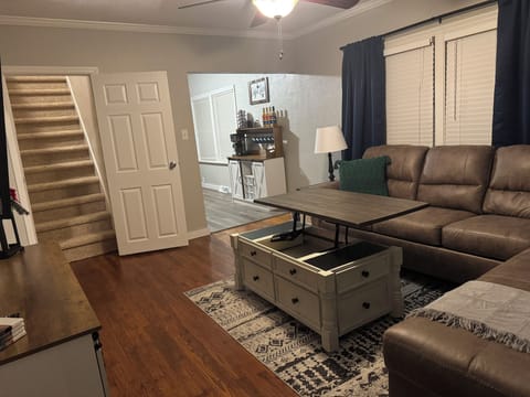 MAIN LEVEL ENTRY: Living Room, Stairs leading up to the Loft and open from Living Room to Deluxe Coffee Station into Kitchen, Games in uplifted Coffee Table