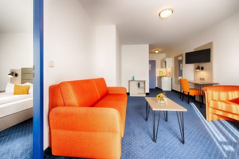 Junior Suite | Living area | 30-inch TV with satellite channels