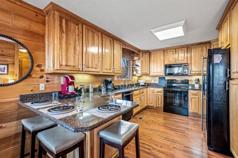 Fully stocked kitchen with modern appliances and rustic charm—perfect for home-cooked meals.