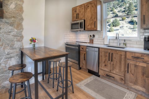 Kitchen - Kitchen with dining area connected to the living room for an open living area.