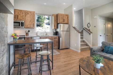 Main living space - The main floor with living room, kitchen, queen bedroom and bathroom. Head upstairs to access the back patio and second and thrid bedrooms as well as the second bathroom and stackable washer and dryer.