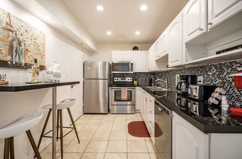 Apartment, Ocean View, Oceanfront | Private kitchen | Fridge, microwave, stovetop, dishwasher