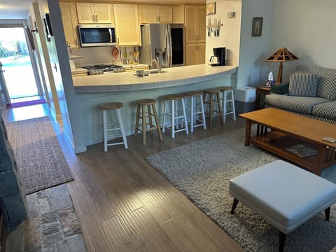 View of kitchen and entrance from the living room