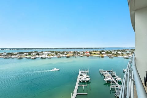 Elevated waterfront view showcasing a private marina and expansive coastal scenery. Bella Luna offers a luxurious lifestyle with direct water access and stunning panoramic vistas.