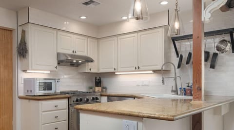 Spacious layout makes meal prep and gathering effortless and enjoyable.