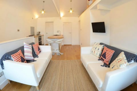 Open plan living area with 2 sofas