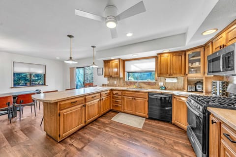 Kitchen: Keurig, Crockpot, blender, cooking utensils, tableware