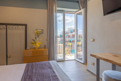 Deluxe Double or Twin Room, Balcony, Partial Sea View | In-room safe, desk, laptop workspace, soundproofing