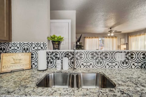 Enjoy a stylish and functional kitchen with modern finishes, granite countertops, and an open layout perfect for cooking and entertaining.