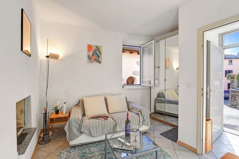 Family Apartment, 1 Bedroom (Lugano Bay View Uno) | Living area | 21-inch TV with cable channels