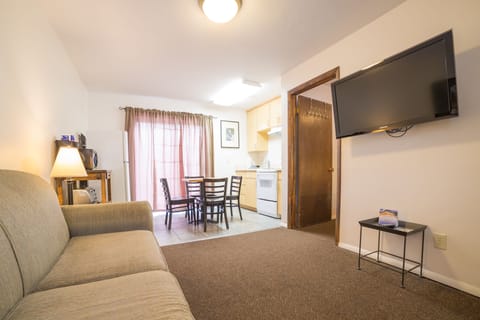 Family Room, Multiple Beds | Living room | Flat-screen TV
