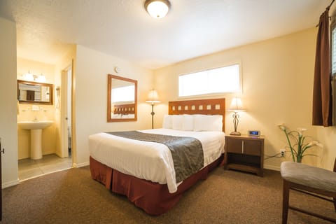 Economy Room, 1 Queen Bed, Refrigerator | Blackout drapes, iron/ironing board, free WiFi, bed sheets