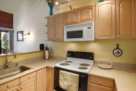 The open, airy kitchen offers ample space & all the comforts of home