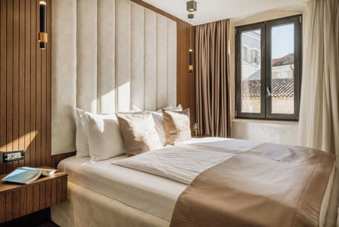 Superior Double Room, City View | Minibar, in-room safe, desk, laptop workspace