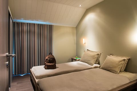 Premium bedding, laptop workspace, iron/ironing board, cribs/infant beds