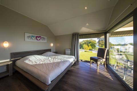 Premium bedding, laptop workspace, iron/ironing board, cribs/infant beds