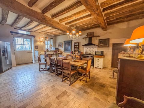 Large kitchen equipped with a gas stove and oven
American-style refrigerator/freezer
Dining table for 14 people
Dishwasher, utensils, and dishes