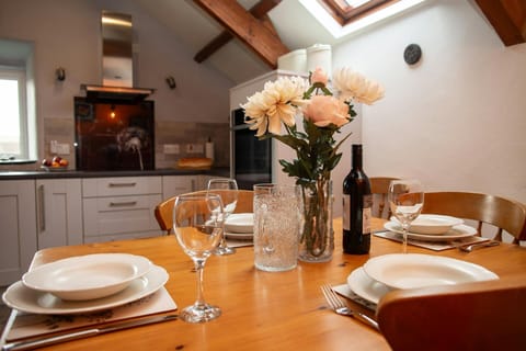 Dining table laid for dinner for four