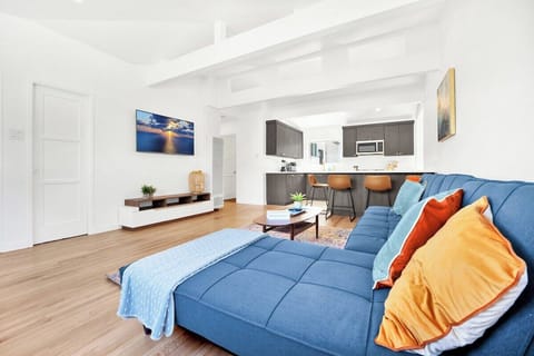 Easy to socialize with the open floor plan. 55in smart tv, large sectional couch and plenty of bar seating. 