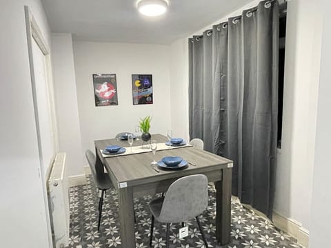 This contemporary dining area combines functionality and style, offering ample space for meals and a cosy ambiance for memorable dining experiences.