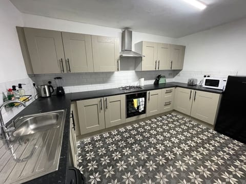 A charming kitchen with a classic design, equipped with rustic elements and plenty of counter space for culinary creations.