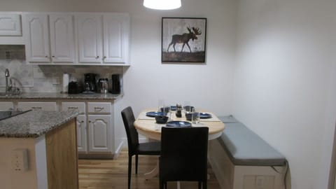 Dining area with additional bar seating on island