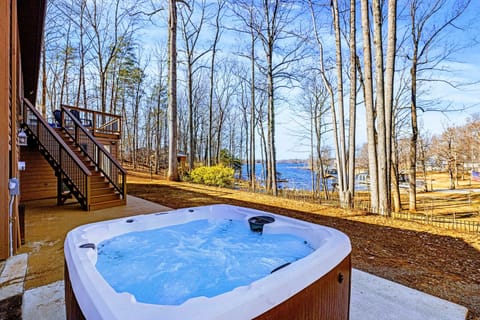 Hot Tub Escape – Warm, bubbling waters with a backdrop of trees and sky.