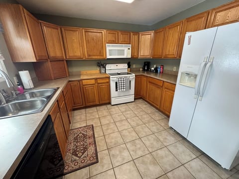 Fully stocked kitchen with everything needed to make meals during your stay. 